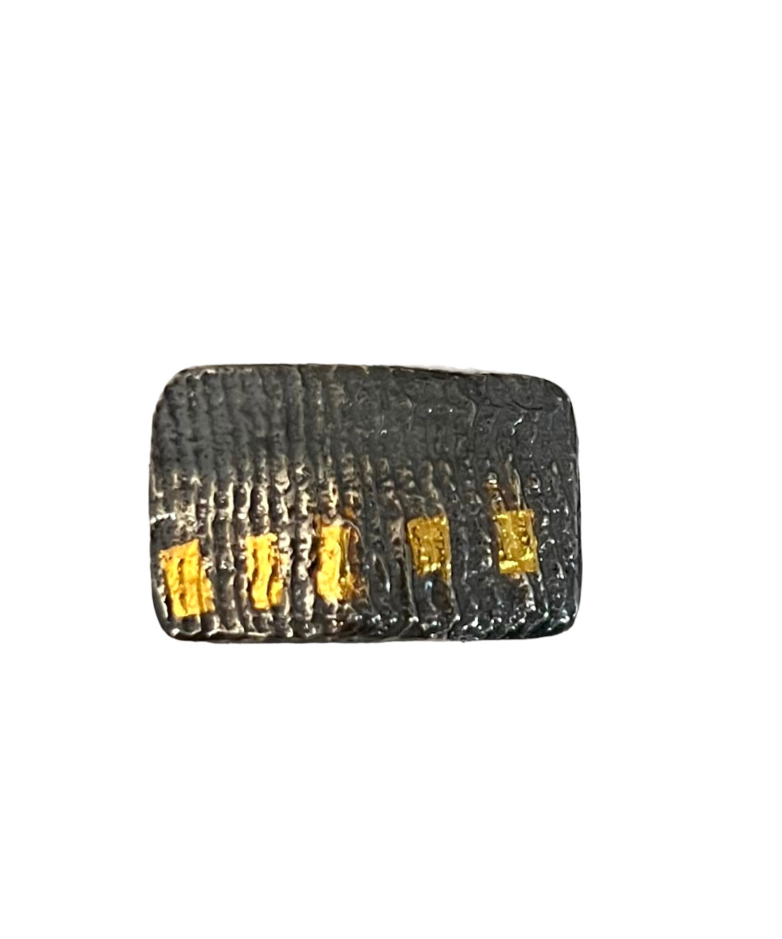 A size 7 ring with a rectangle of cuttlefish cast oxidized sterling silver and 5/24 karat gold keum boo accents